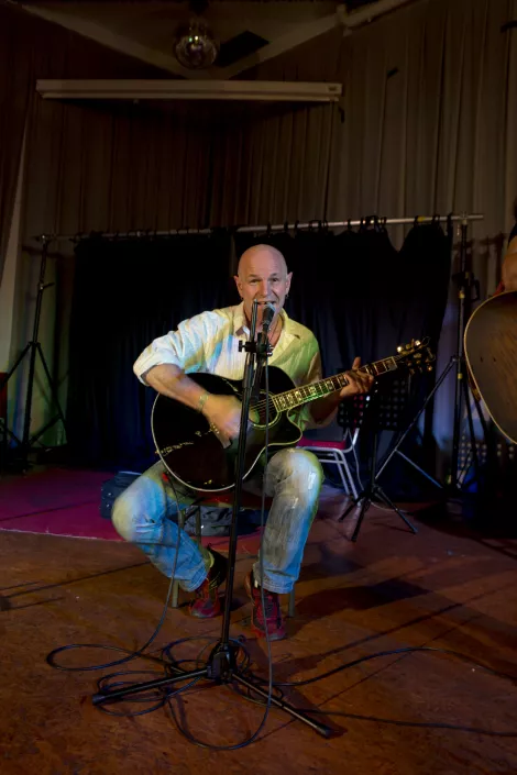 A musician performing a song at the Unperfekthaus in Essen A musician performing a song at the Unperfekthaus in Essen