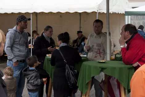People eating Currywurst at an event in Essen, Germany People eating Currywurst at an event in Essen, Germany