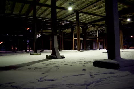 snowed in pillars at a industrial building during winter time snowed in pillars at a industrial building during winter time